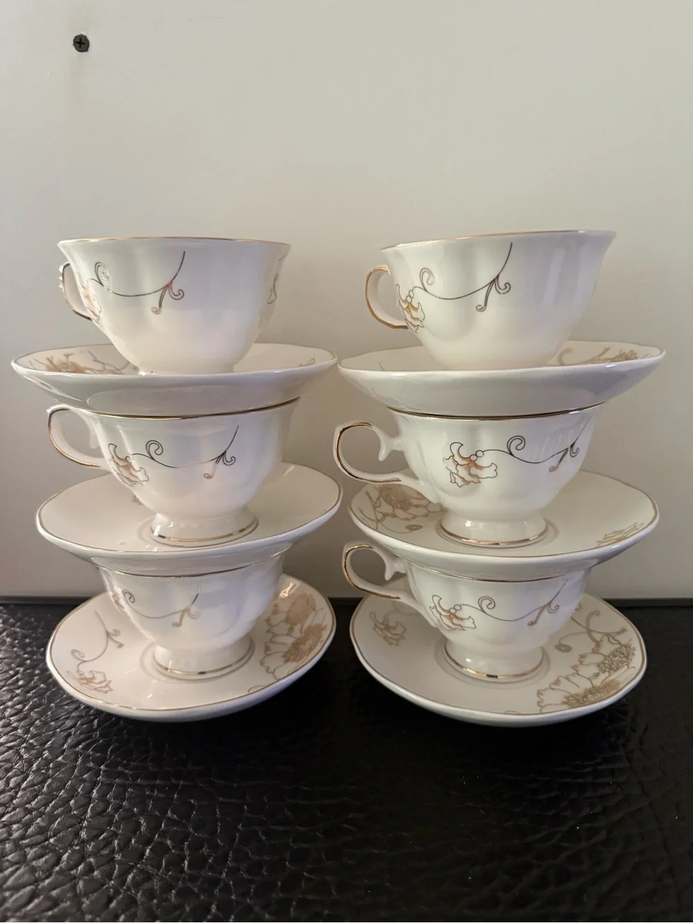 Set Of 6 cup and saucer feature the gold overglaze monogram White porcelain body
